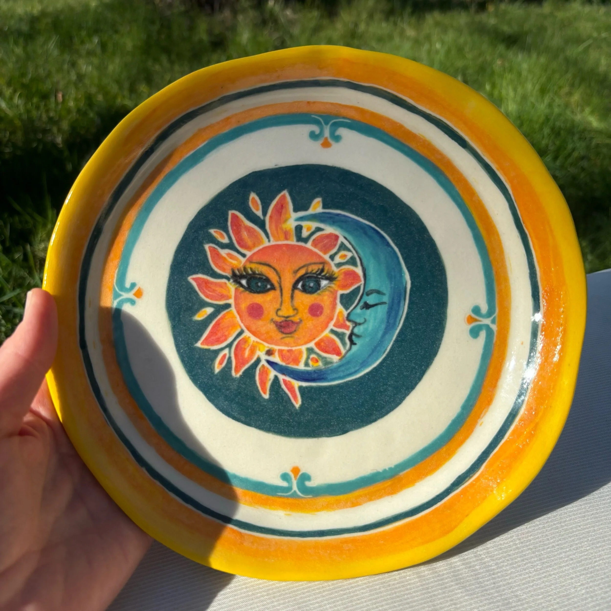 Sun and Moon on green plate